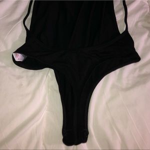 A black backless bodysuit